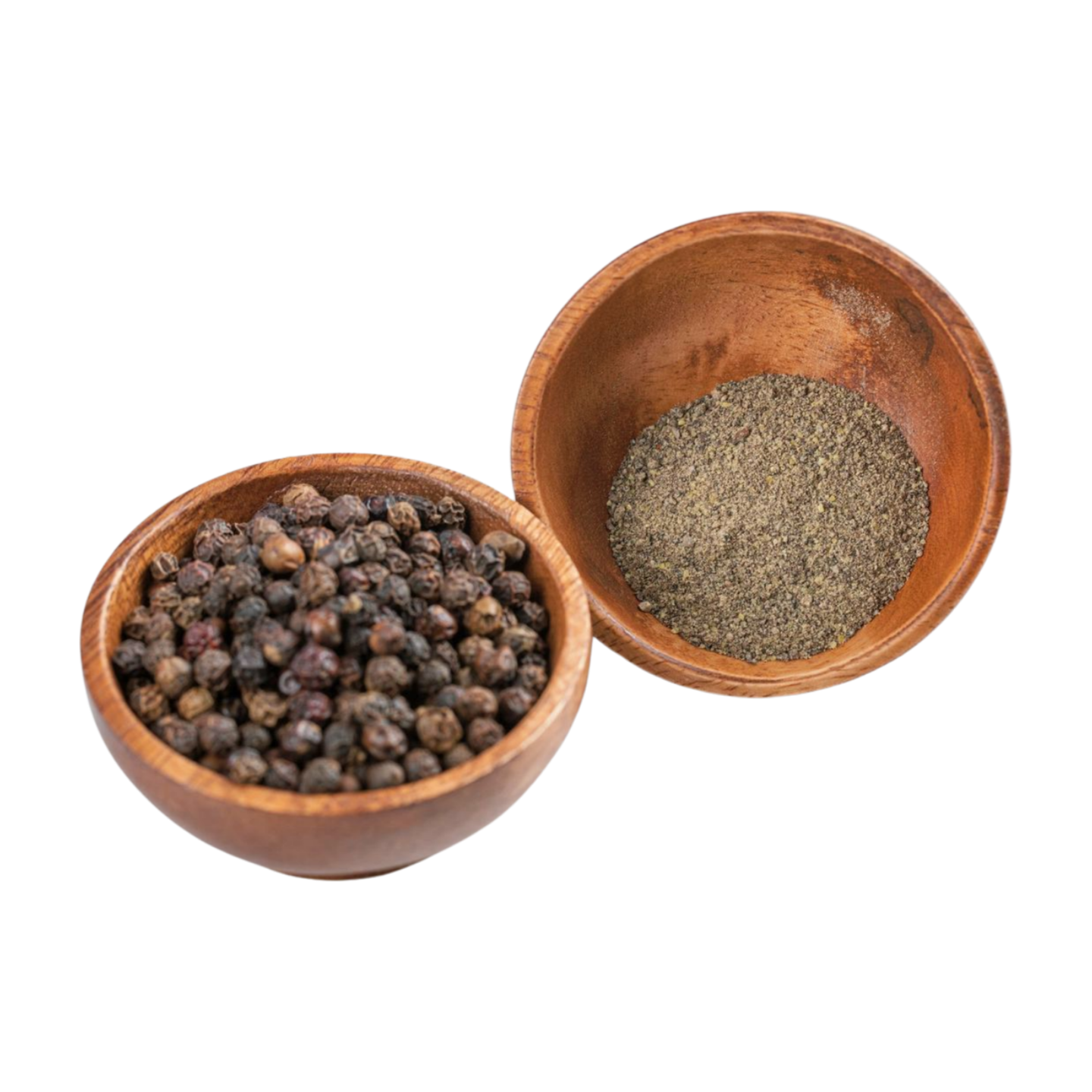 A wooden bowl filled with black pepper powder on a white background